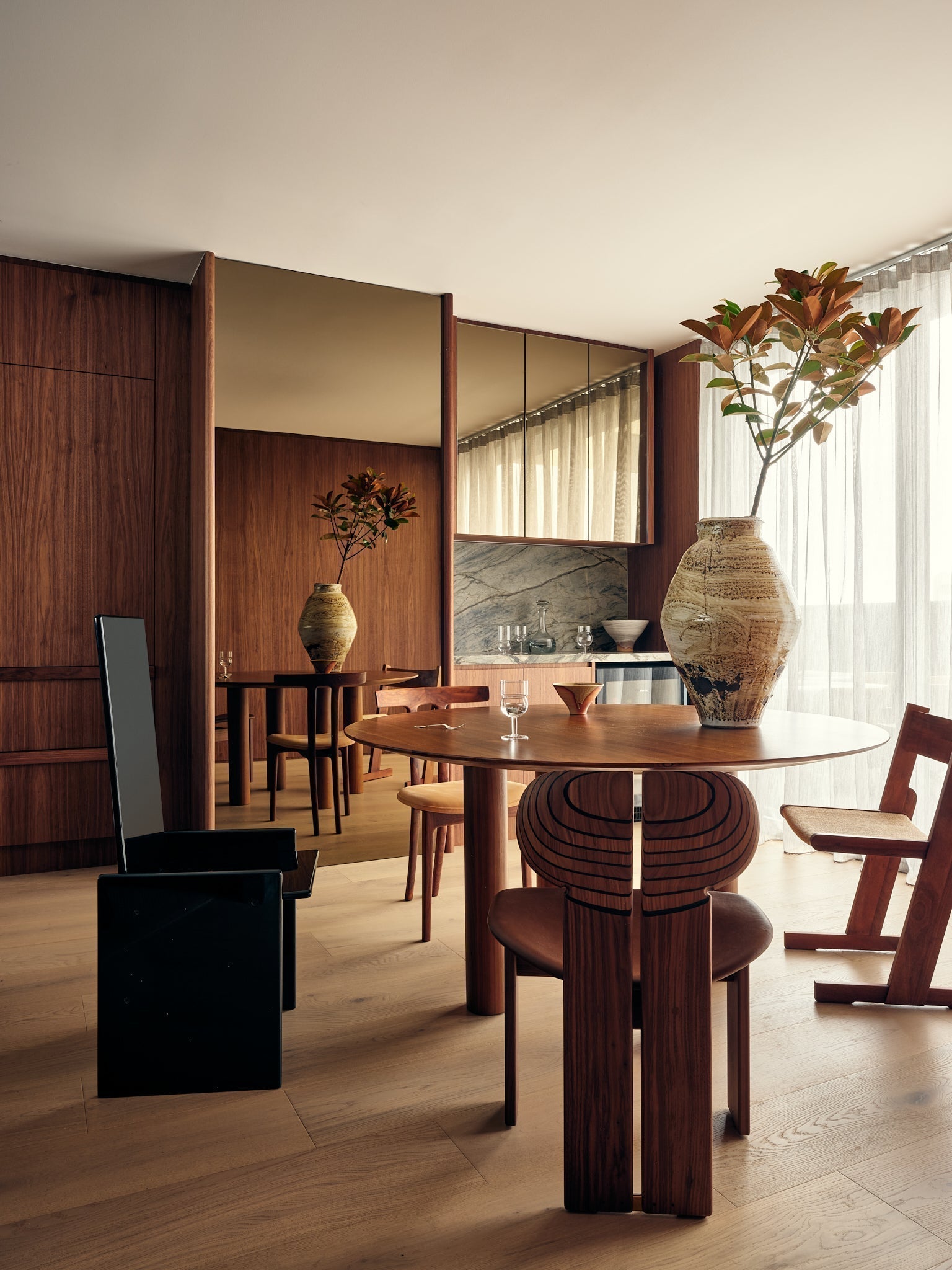 Image of a living room designed by Michael Allsopp and styled by Tom Mesker. Features a large Ochre Hive Vase by Remy Pajaczkowski-Russell
