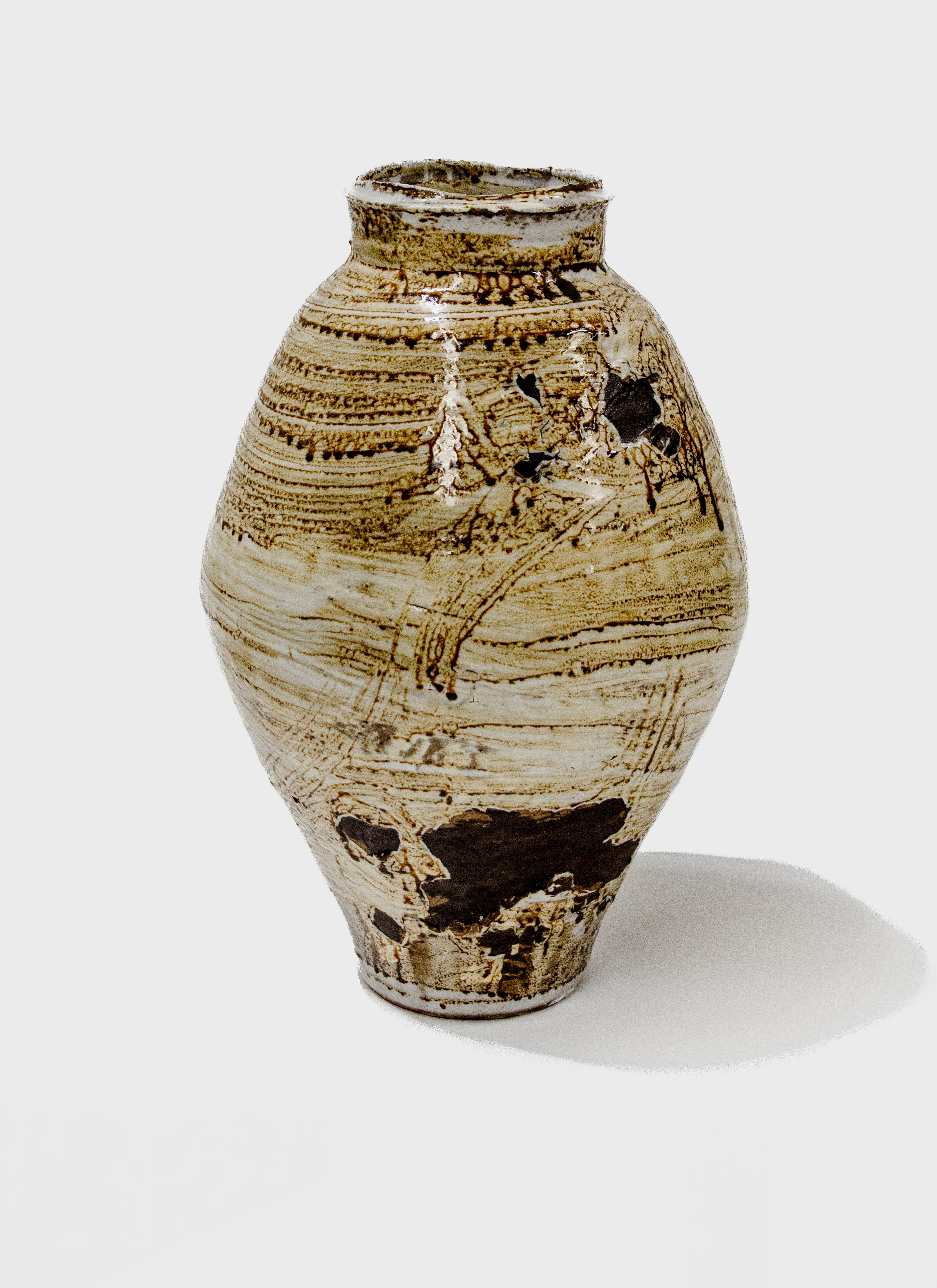 Large stoneware vase glazed in ochre.