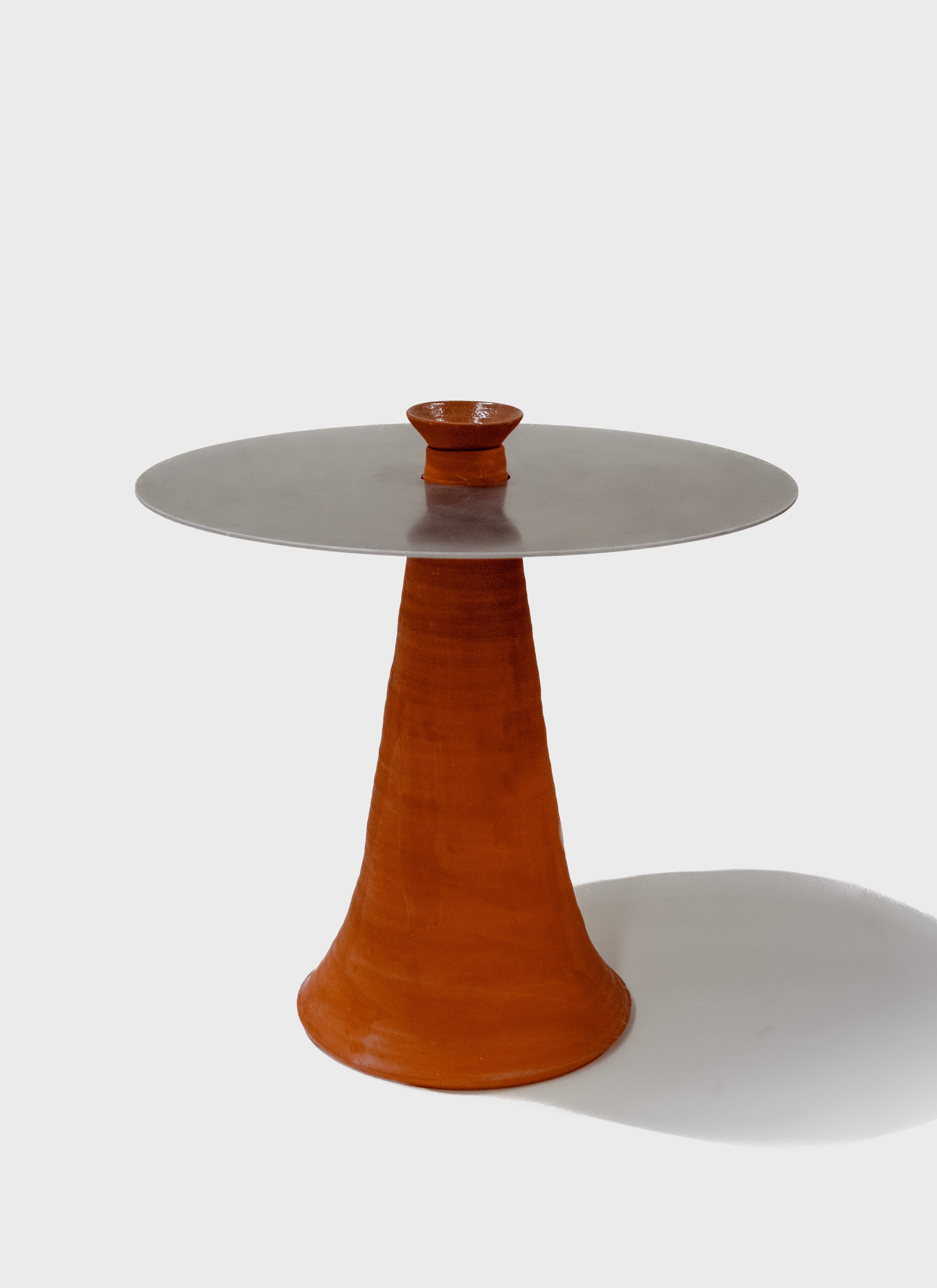 Terracotta table with aluminium top.